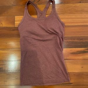 Size 4 lululemon tank top. Sports bra built in.